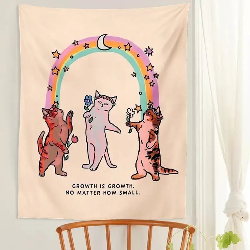 Beige tapestry wall hanging with three illustrated cats under a rainbow holding flowers for boho decorbites cat tapestry