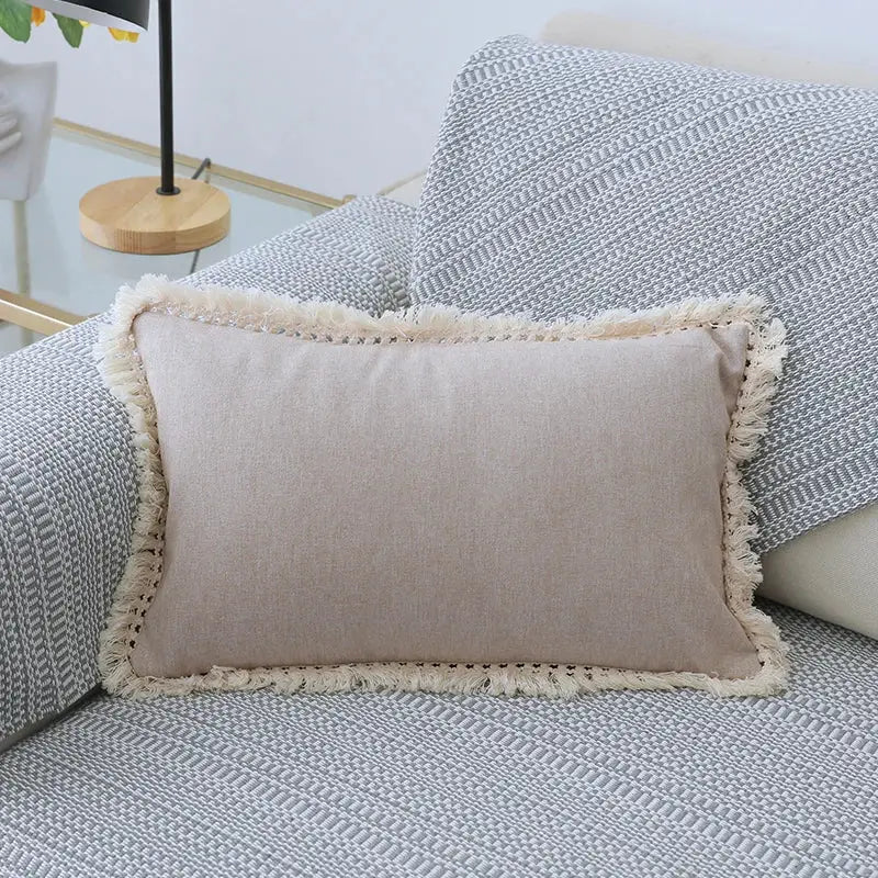 Beige rectangular linen pillow cover set with cream-colored tassels ideal for boho living room sofa decor