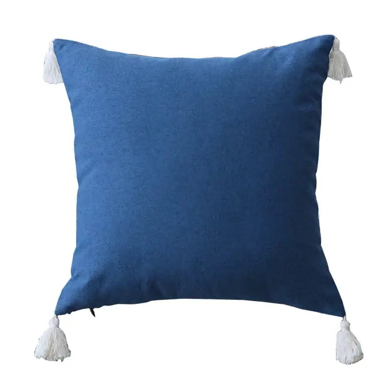 Deep blue linen pillow cover with white tassels in a boho pillow cover set for living room sofa decor