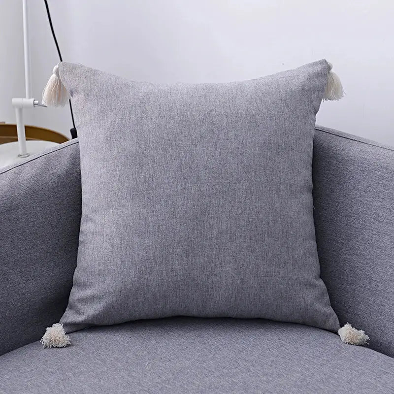 Boho beige linen tassel pillow cover set with gray textured cushion and cream tassels for living room sofa