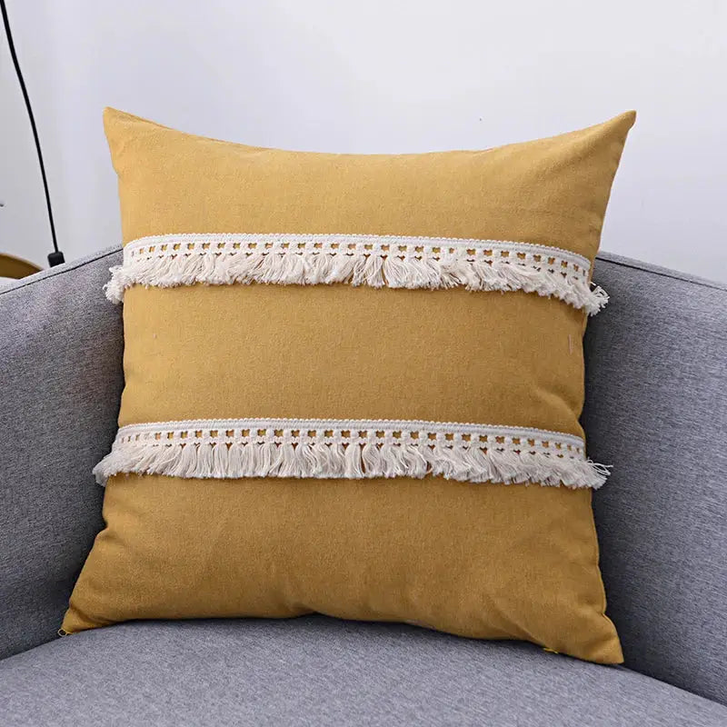 Boho beige linen tassel pillow cover set featuring a mustard yellow pillow cover with cream fringe trim for sofa use