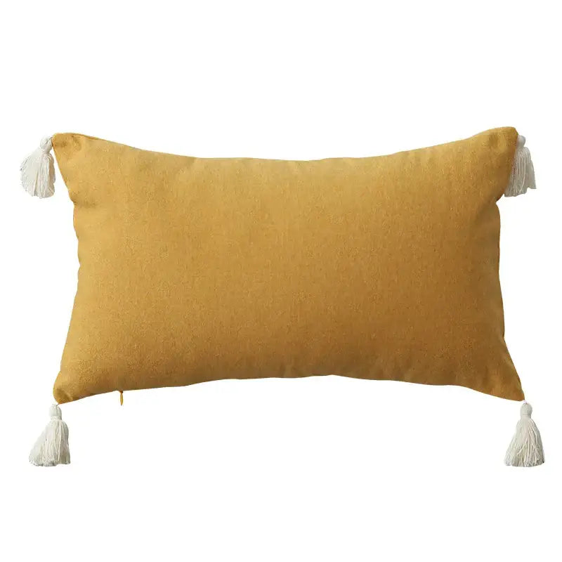 Boho beige linen pillow cover set featuring a mustard-yellow rectangular cushion with white tassels for sofa