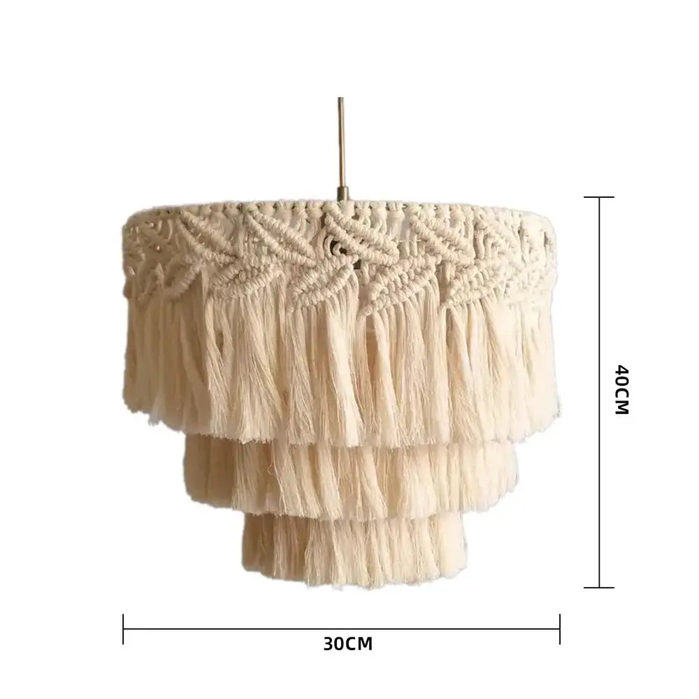Cream-colored boho beige macrame pendant light cover with layered tassels and intricate woven patterns for bedroom chandelier