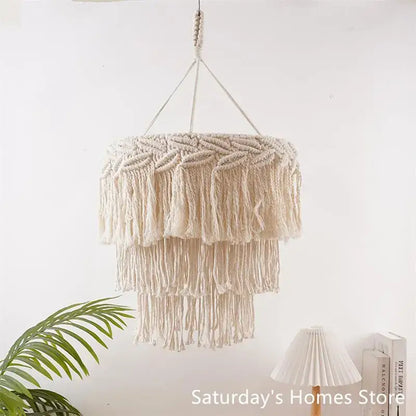 Boho beige macrame pendant light cover with layered fringe and braided top designed as a bedroom chandelier light cover