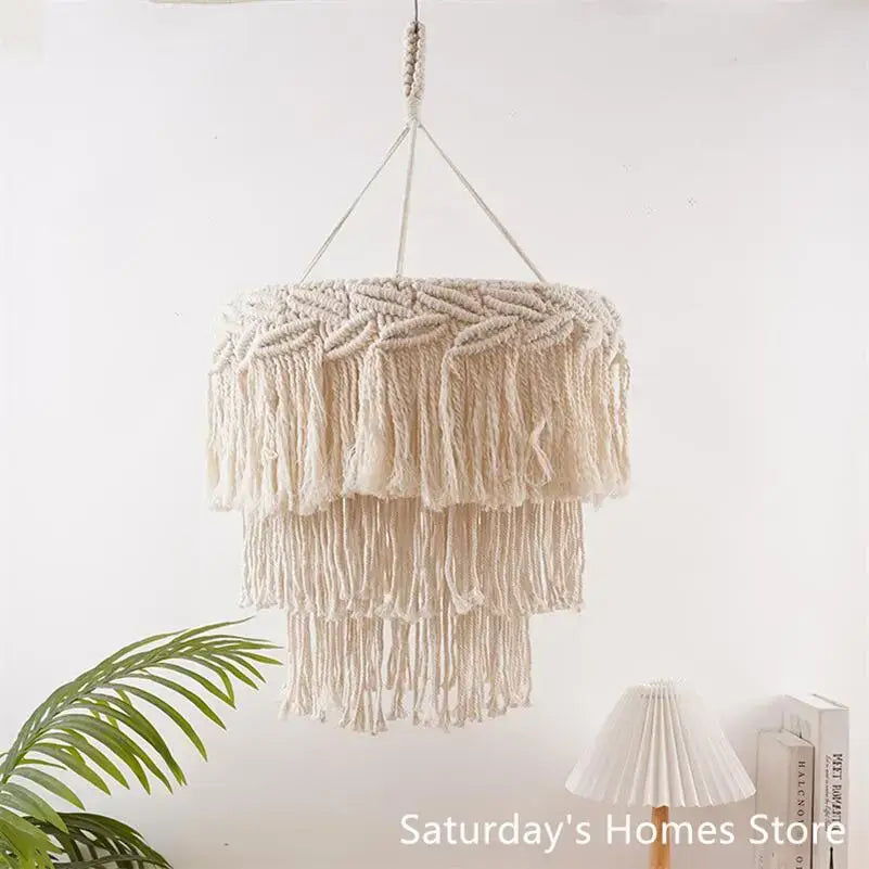 Boho beige macrame pendant light cover with layered fringe and braided top designed as a bedroom chandelier light cover