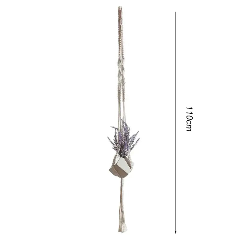 Beige macrame plant hanger basket with geometric ceramic pot holding dried lavender for boho living room decor