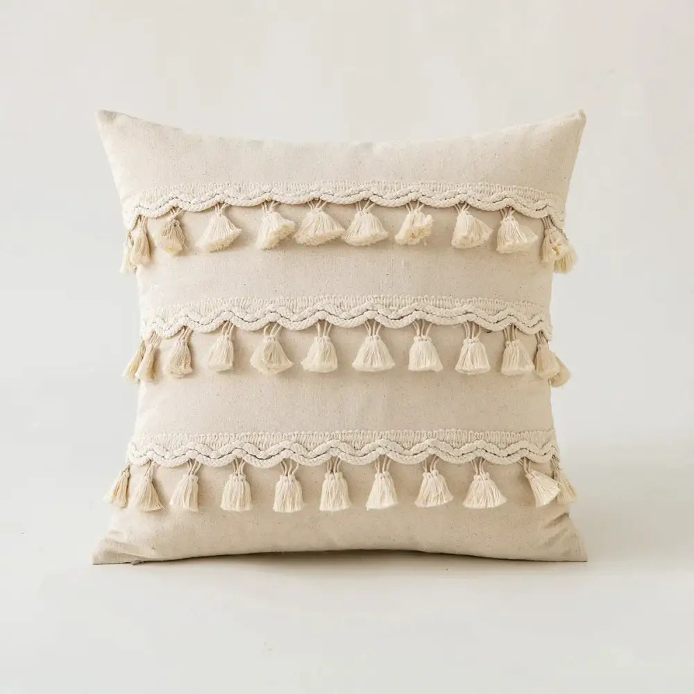 Beige cotton cushion cover with cream lace rows and tassels featured in decorbites beige tufted fringed design