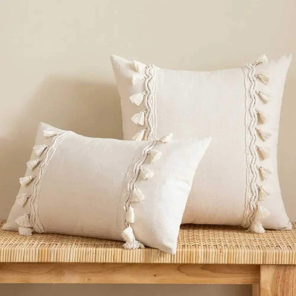 Cream-colored boho beige tufted fringed cushion cover with textured fabric and decorative tassel trim for living room decor