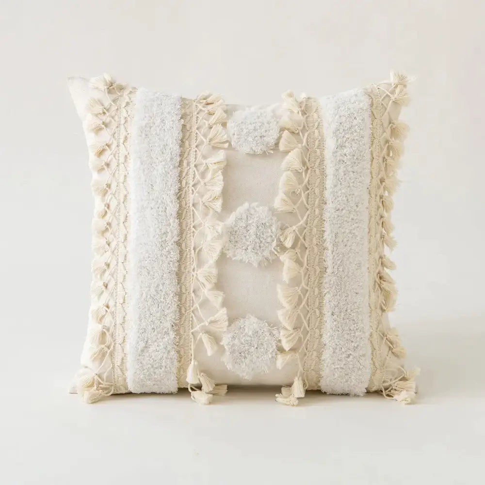 Cream-colored boho beige tufted fringed cushion cover with textured stripes pom-poms and tassel trim for living room decor