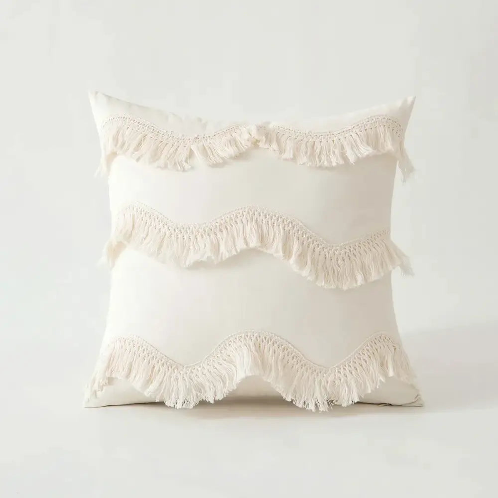 Cream-colored boho beige tufted fringed cushion cover with three horizontal rows of soft wavy fringe detailing