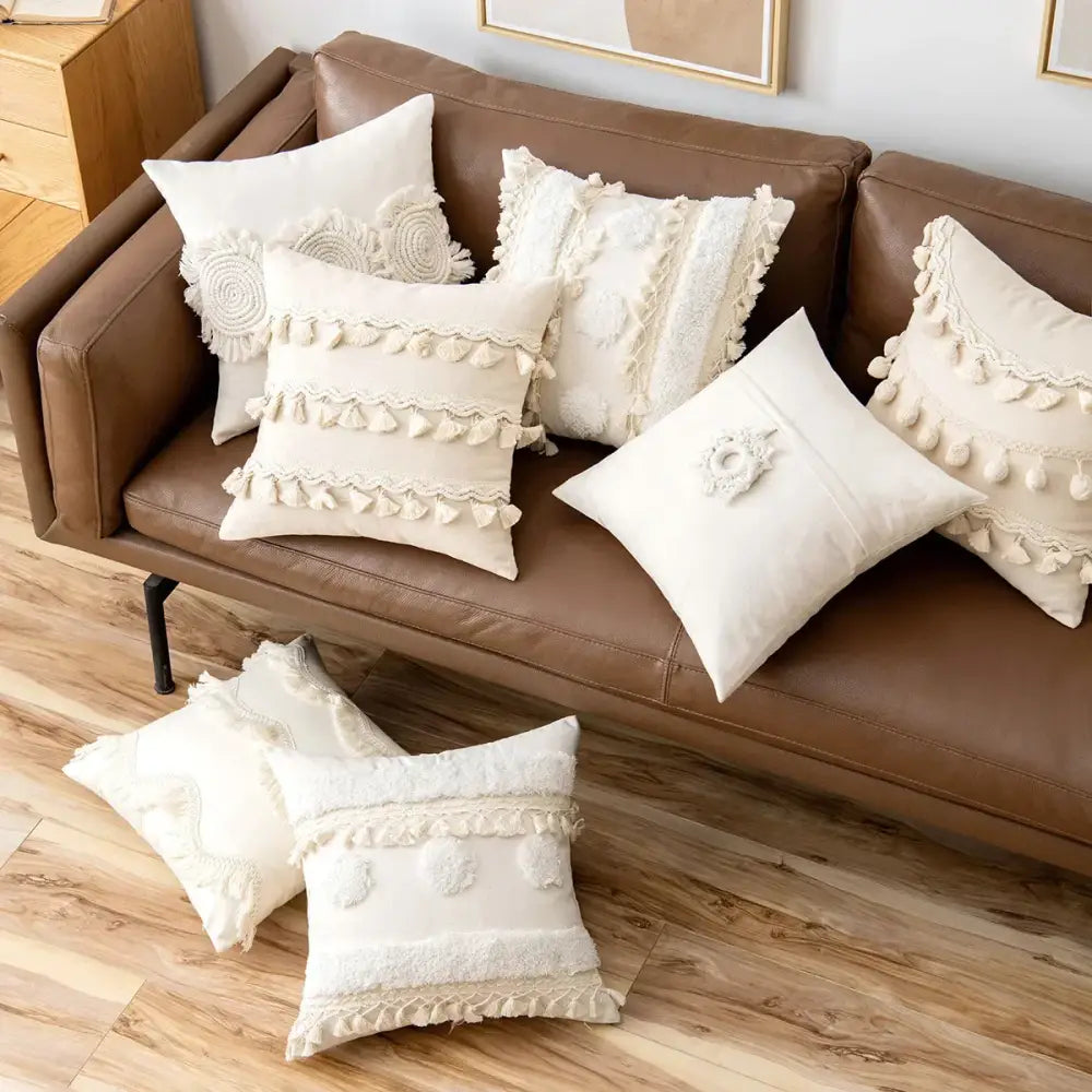 Cream-colored cushion cover with tufted fringed texture tassels and embroidered details from decorbites beige tufted collection
