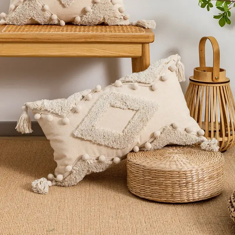 Beige tufted fringed geometric pillow cover with pom-poms and tassels for boho living room decor