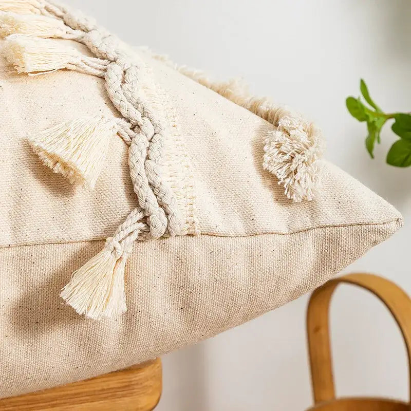 Beige canvas pillow cover with tufted fringed geometric design braided rope and tassels for living room decor