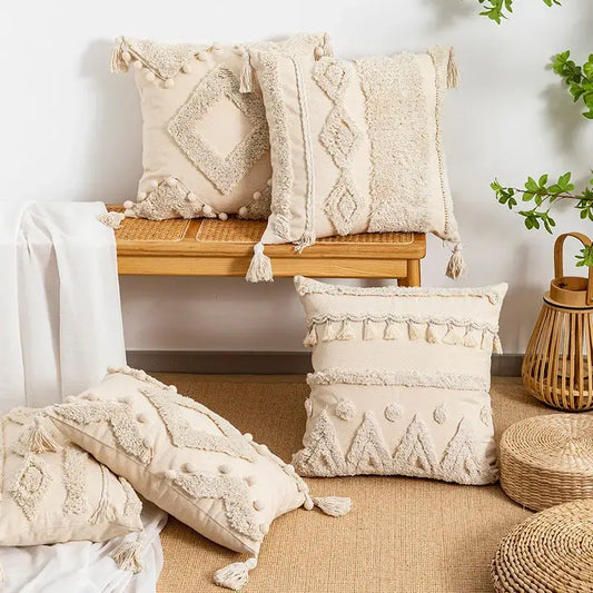 Beige tufted fringed geometric pillow cover with tassels and pom-poms for boho living room decor