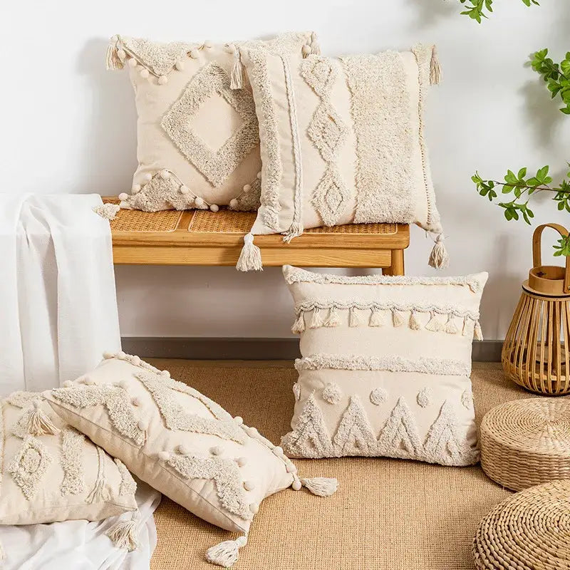 Beige tufted fringed geometric pillow cover with tassels and pom-poms for boho living room decor