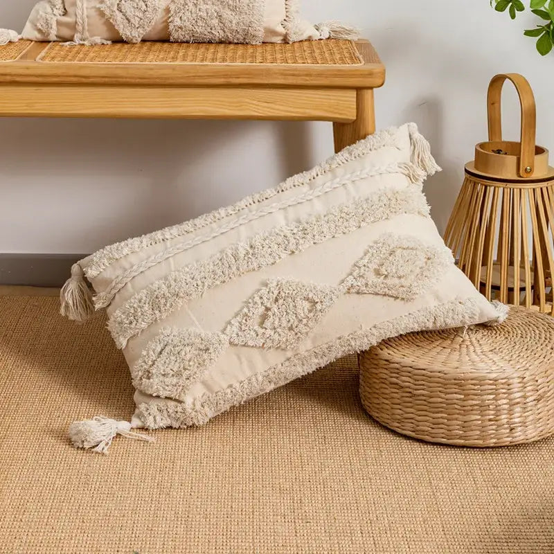 Cream-colored rectangular pillow cover with tufted fringed geometric patterns for living room decor