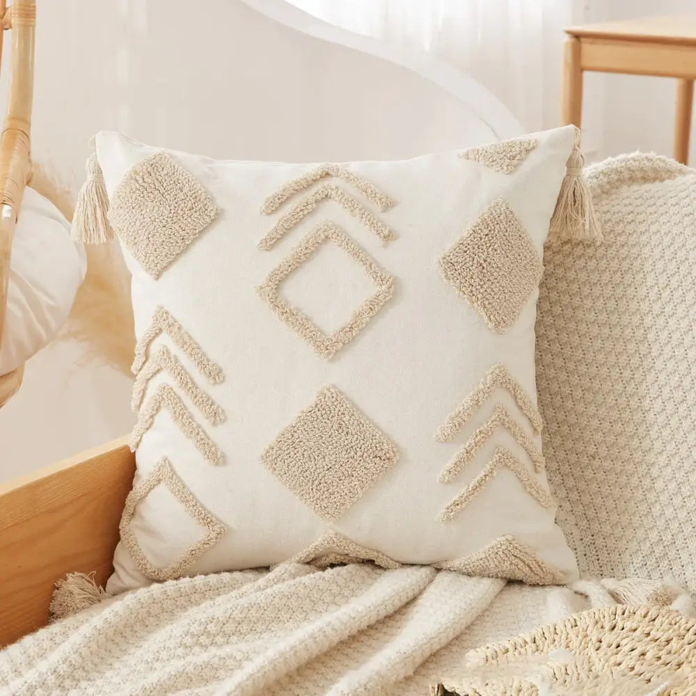 Cream-colored boho beige white pillow case with textured geometric patterns and tassels for living room decorbites boho beige decor