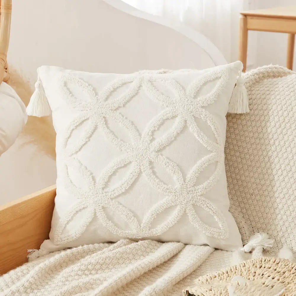 Cream-colored throw pillow with textured embroidered geometric pattern and tassels for decorbites boho beige white pillow cases decor