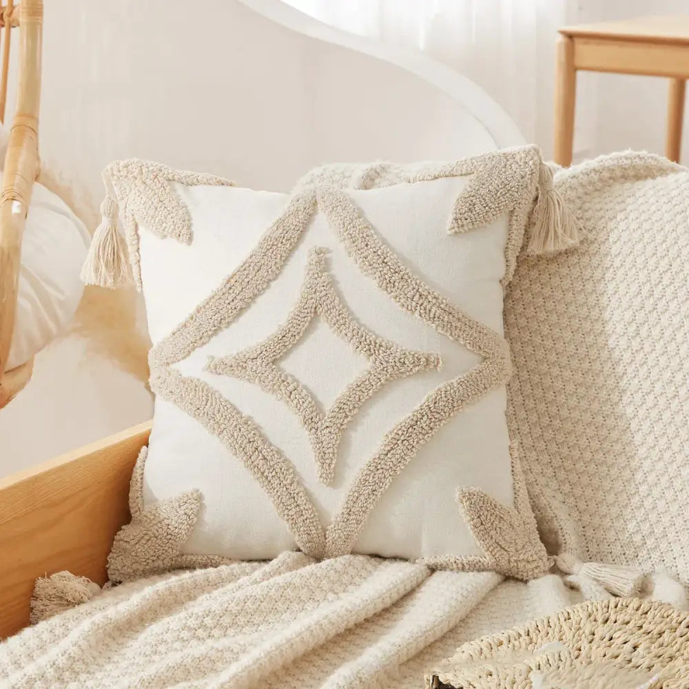 Cream-colored throw pillow case with textured beige geometric embroidery tassels decorbites boho beige white design
