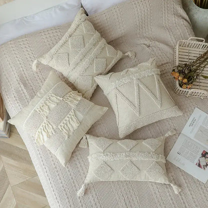 Cream-colored boho beige white tufted throw pillow covers with geometric embroidery and tassels for bedroom decorbites decor