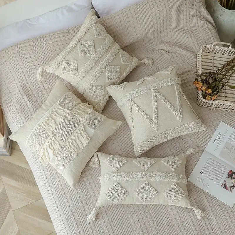 Cream-colored boho beige white tufted throw pillow covers with geometric embroidery and tassels for bedroom decorbites decor