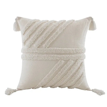 Cream-colored decorbites boho beige white tufted tassel pillow cover with woven diagonal and corner tassels for bedroom decor
