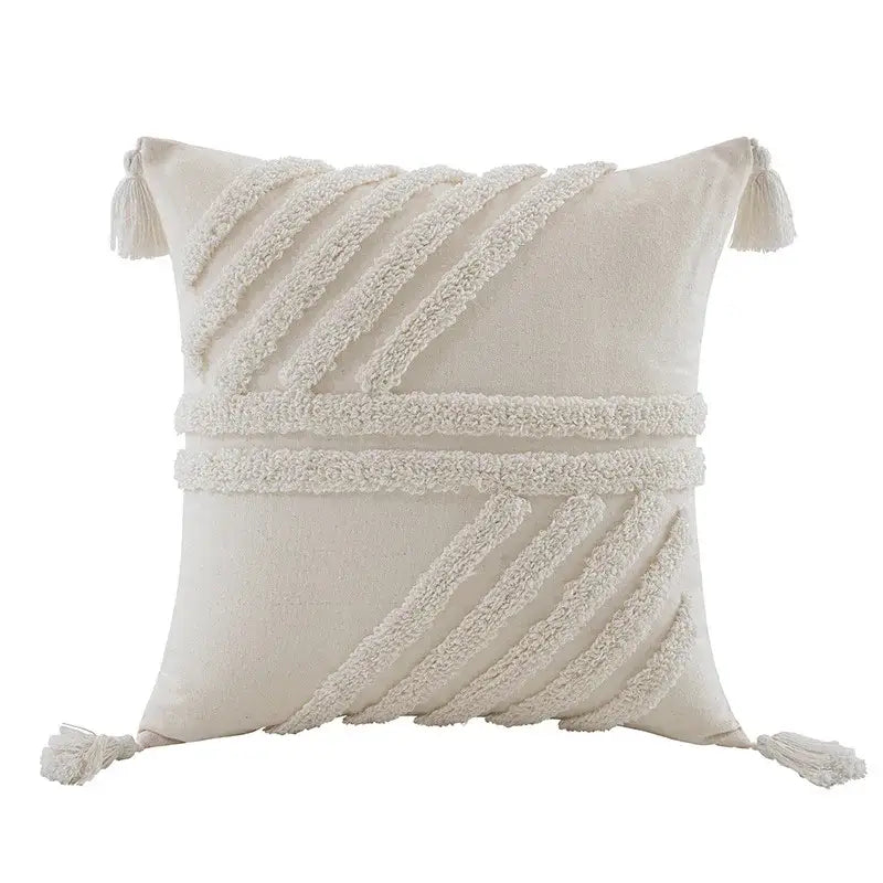Cream-colored decorbites boho beige white tufted tassel pillow cover with woven diagonal and corner tassels for bedroom decor