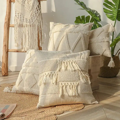Cream-colored boho beige white tufted pillow covers with woven geometric patterns and tassels for bedroom decor