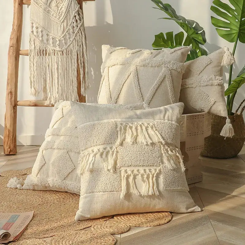 Cream-colored boho beige white tufted pillow covers with woven geometric patterns and tassels for bedroom decor