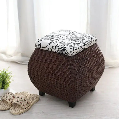 Brown woven rattan 3-in-1 storage stool with white lid featuring black floral embroidery for bedroom footrest
