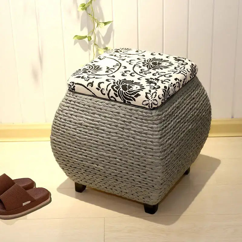 Gray woven rattan 3-in-1 storage stool with black and white floral fabric lid for bedroom footrest and storage