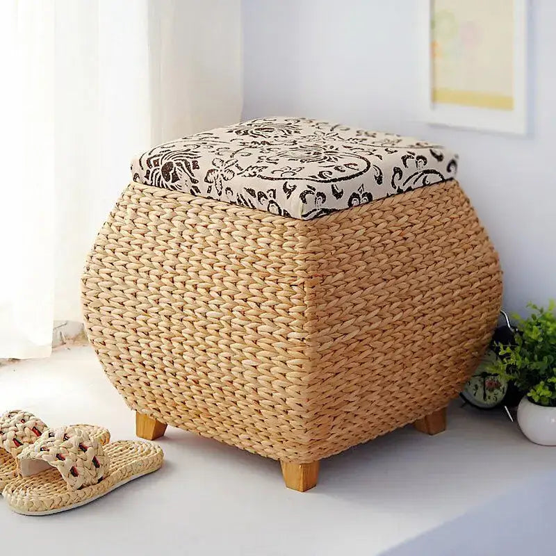 Beige woven rattan 3-in-1 storage stool with black and cream floral fabric lid for bedroom storage and footrest