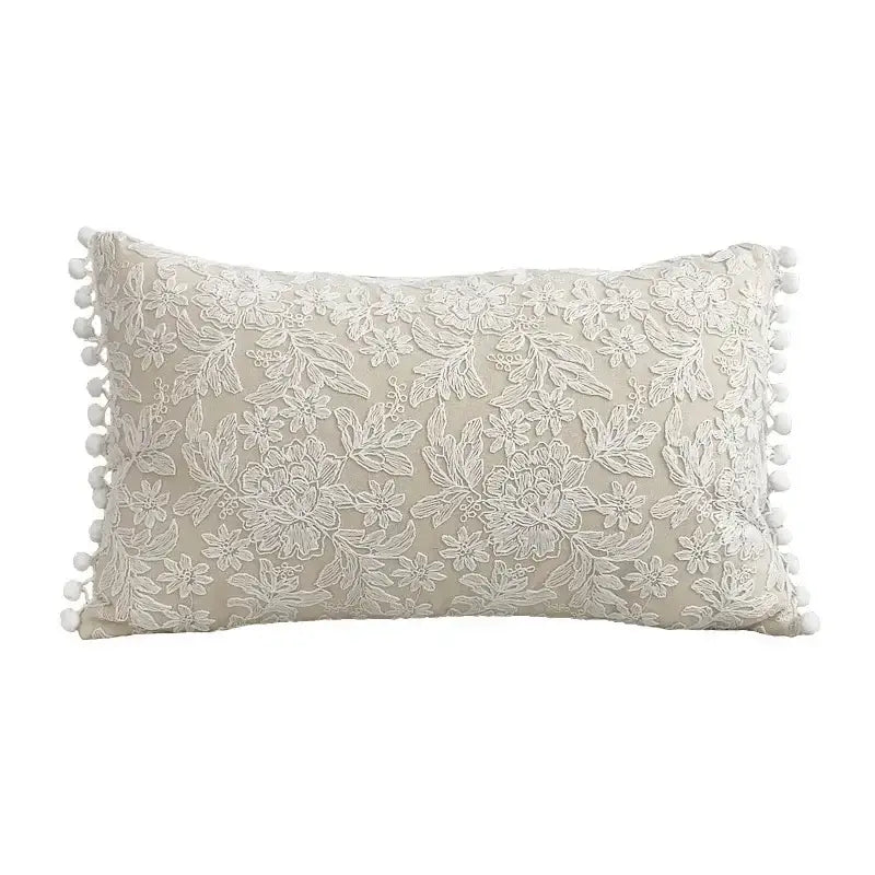 Beige linen cotton pillow cover with white floral lace embroidery and pom-pom trim for boho living room decor