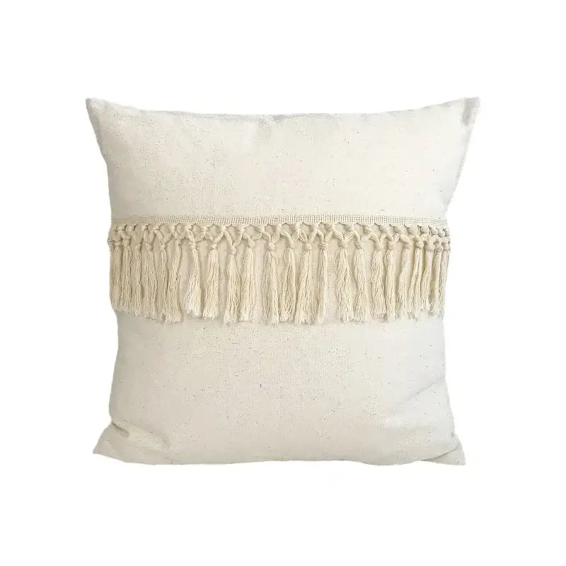 Cream-colored linen cotton pillow cover with horizontal macrame fringe band for boho living room decor