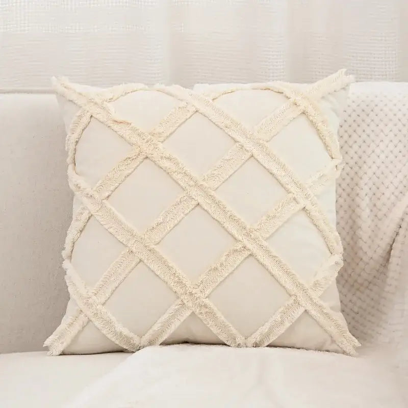 Cream-colored boho pillow cover with textured frayed lattice design made of linen cotton for living room decor