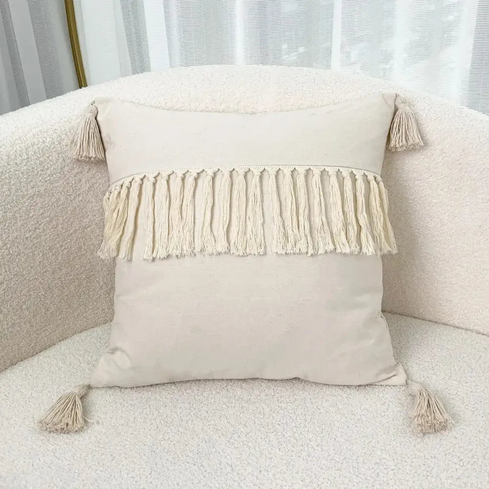 Cream-colored boho linen cotton pillow cover with fringe tassels and corner tassels for living room decor
