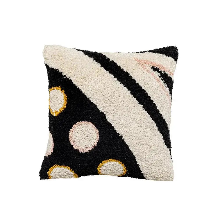 A plush boho big eye tufted cushion cover with black cream stripes and pink gold accents for bedroom or living room decorbites