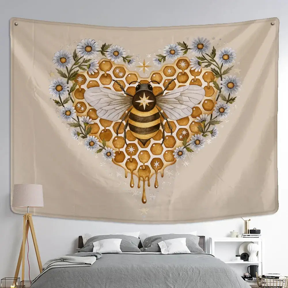 Beige wall hanging tapestry featuring a black and gold bee surrounded by honeycomb and daisy heart patterns for bedroom decor