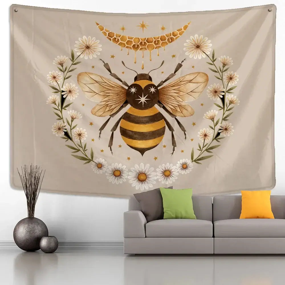 Beige wall hanging tapestry featuring a black and gold bee surrounded by white daisies in a boho daisy wall hanging design
