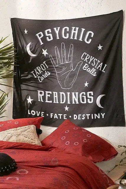 Black fabric wall hanging featuring white psychic readings text handprint and divination tapestry pink ouija design