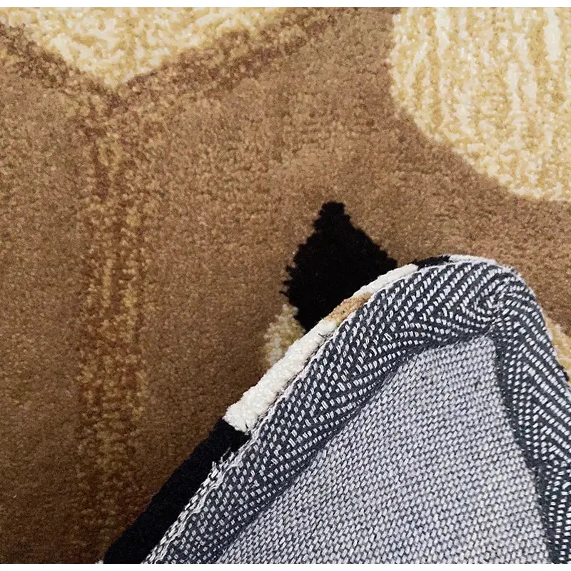 Boho black bear rug with plush textured surface and abstract geometric pattern in earthy brown and beige tones by decorbites