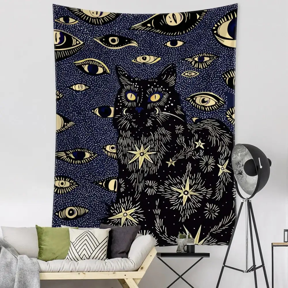 Boho black and gold cat eyes tapestry featuring a central cat with eyes stars and celestial decorbites cat eyes design