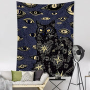 Boho black and gold cat eyes tapestry featuring a central cat with eyes stars and celestial decorbites cat eyes design