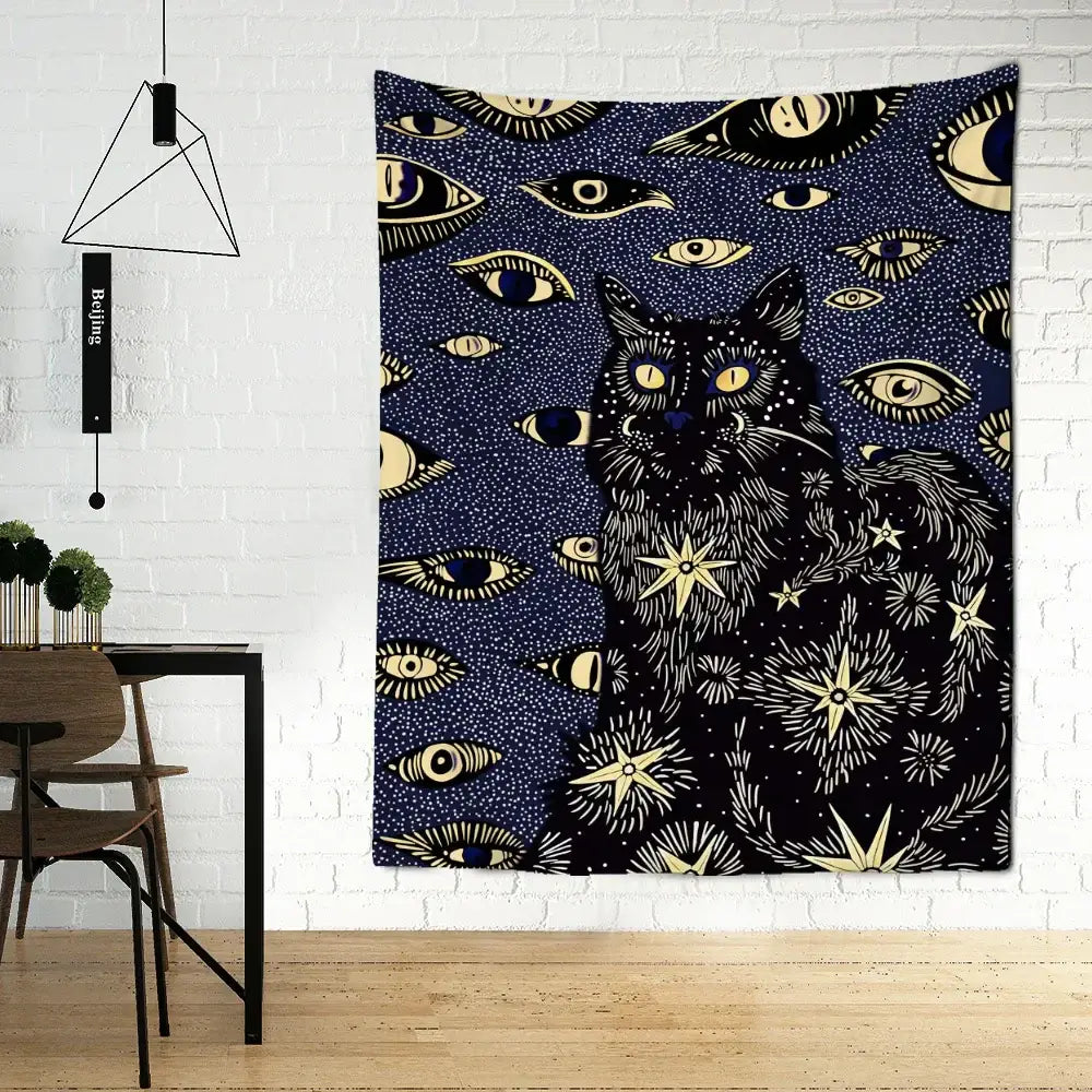 A dark blue boho cat eyes tapestry featuring a black cat with glowing yellow eyes and celestial gold decorbites motifs