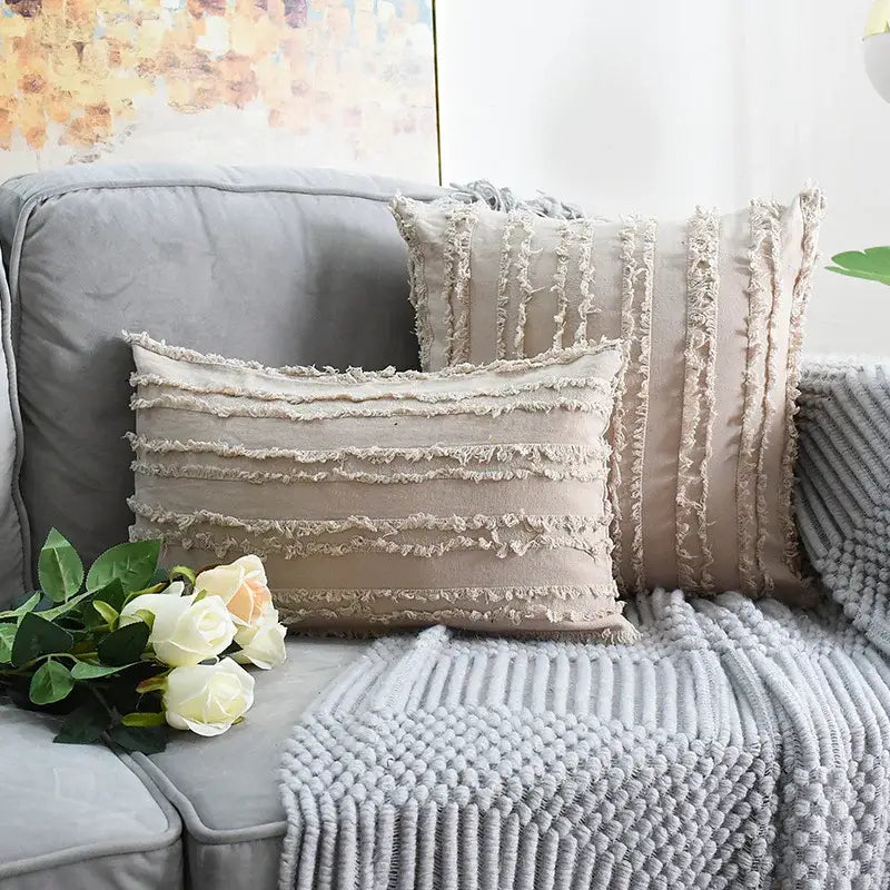 Beige rectangular pillow cover with tassel striped design and textured rustic fabric for boho home decor