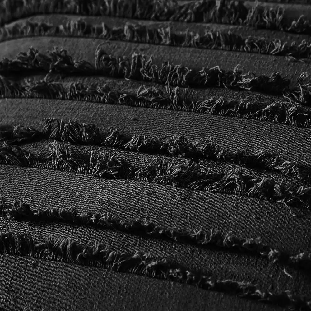 Boho black tassel striped pillow covers featuring black denim fabric with frayed distressed edges for home decor