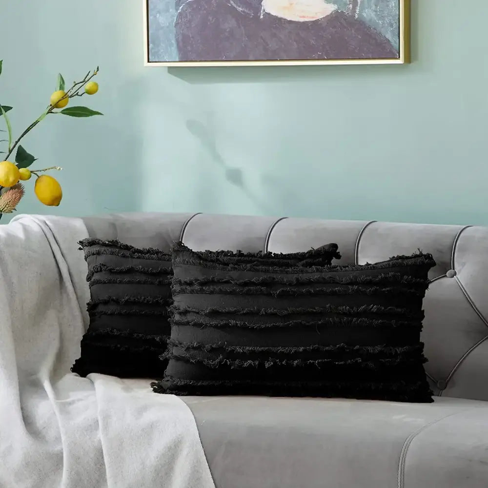 Black rectangular pillow covers with layered frayed fabric and tassel striped design for boho home decor