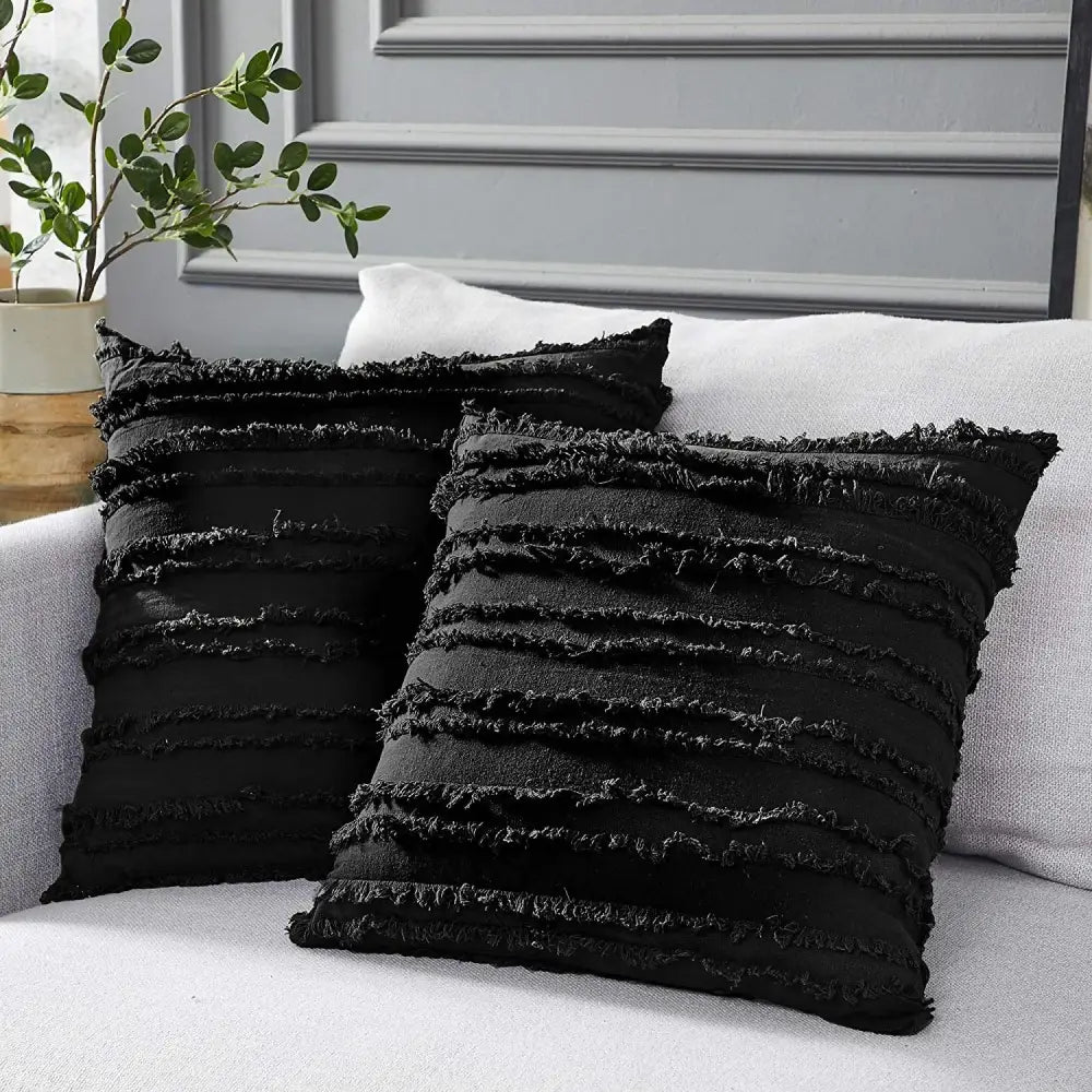 Boho black tassel striped pillow covers featuring textured fabric and frayed horizontal stripes for home decor