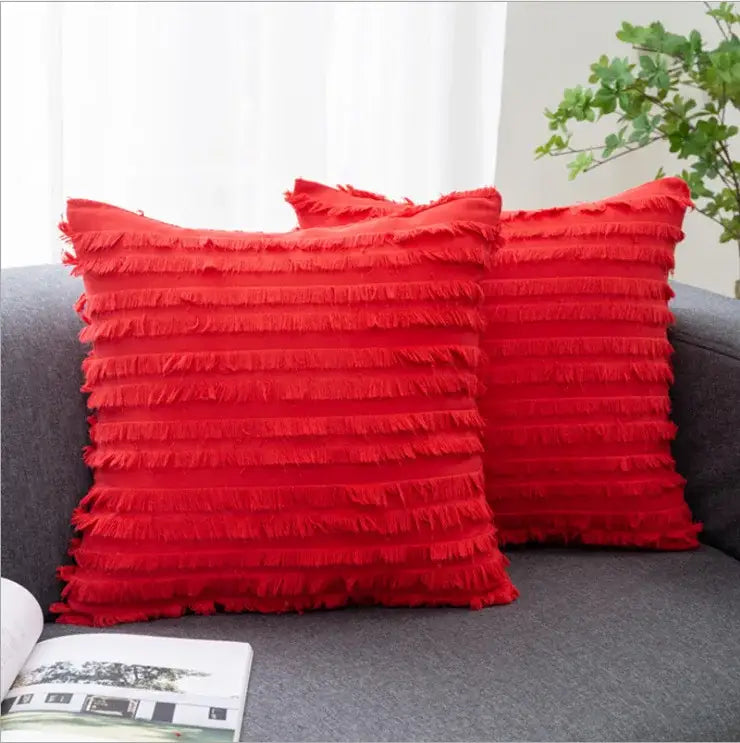 Vibrant red square pillow covers with layered textured fringe and boho black tassel striped design for home decor