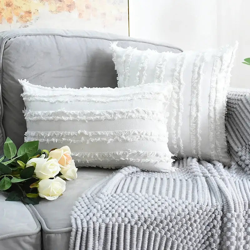 White rectangular pillow cover with frayed tassel striped design and woven texture for boho home decor